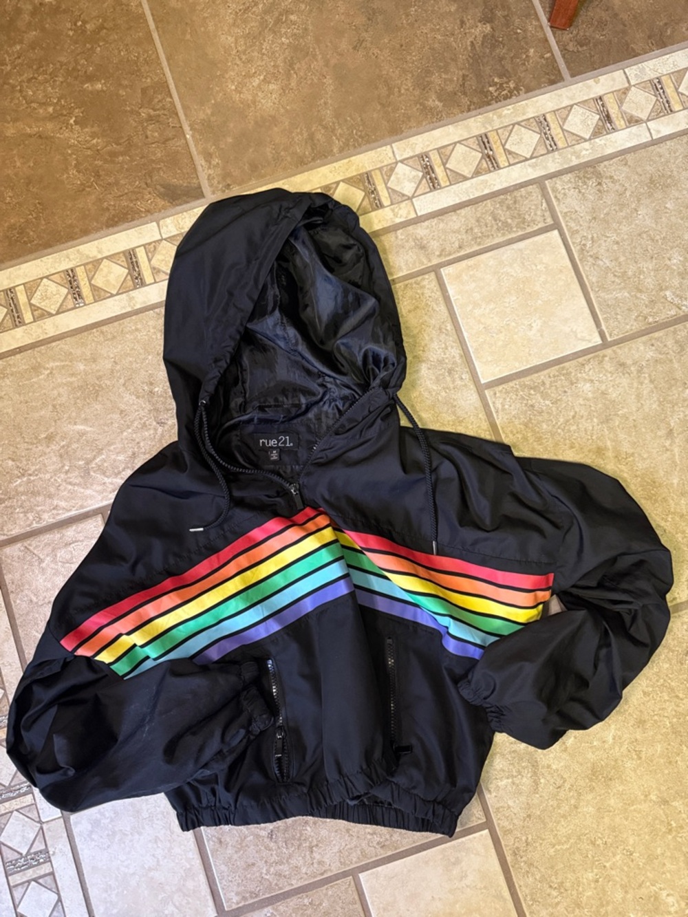 Rue21 Black Hooded Rain Jacket with Rainbow Stripes, cropped.
